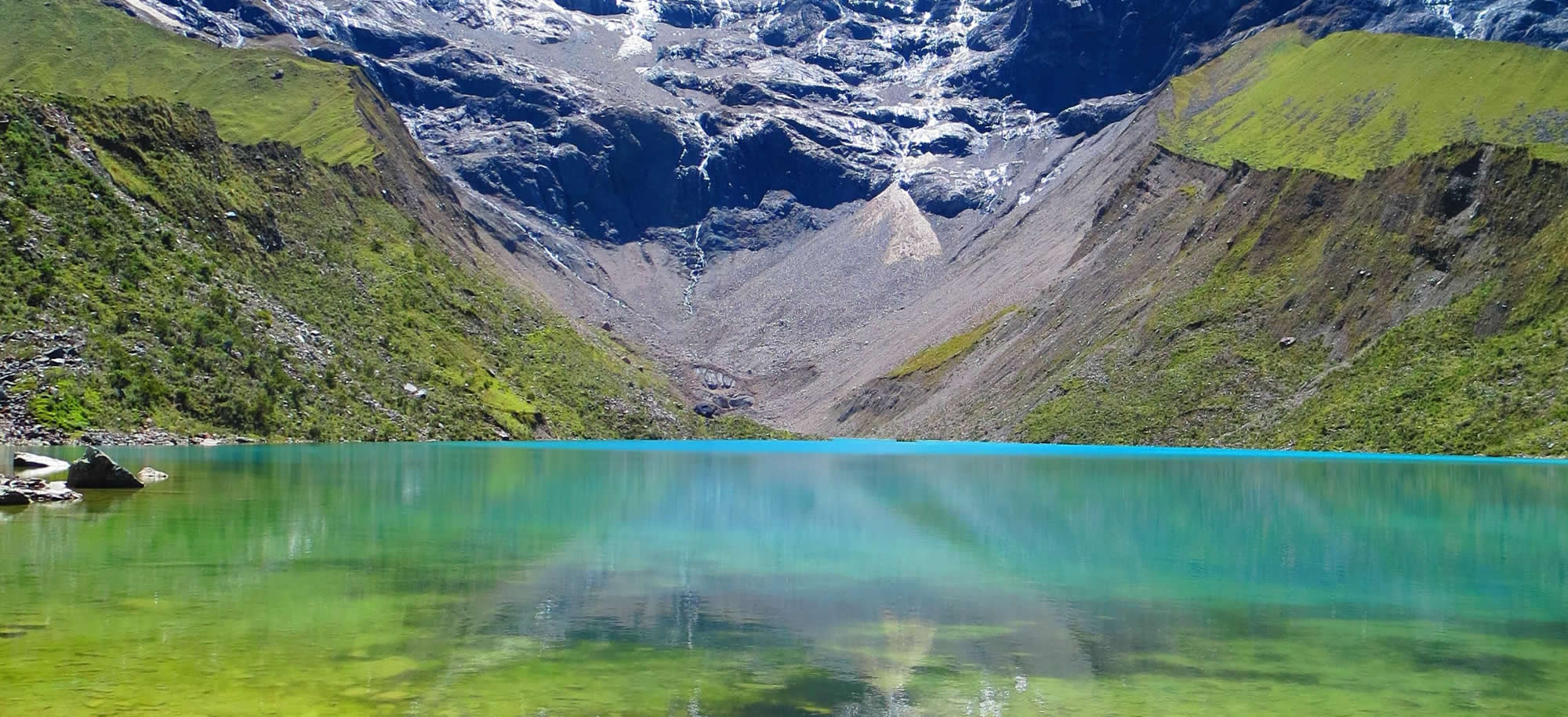 The famous Sky Camp in Soraypampa under the impressive humantay mountain lighted for the light of the starts. Stargazing in Peru.